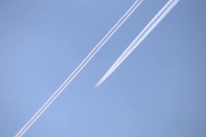 The rear aircraft's trails dissipates very quickly, while the forward one goes onto to produce a cloud-like formation